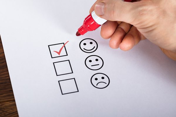 check box with happy face smiley checked
