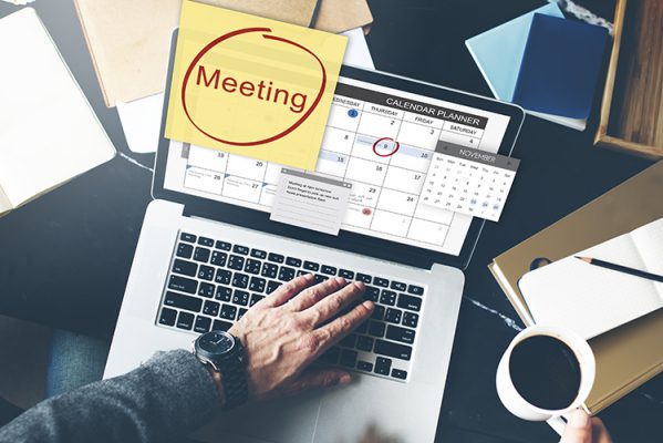 laptop displaying calendar with event shighlighted