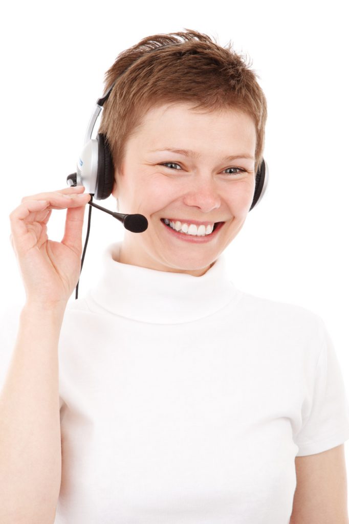 Smiling woman wearing telephone headset